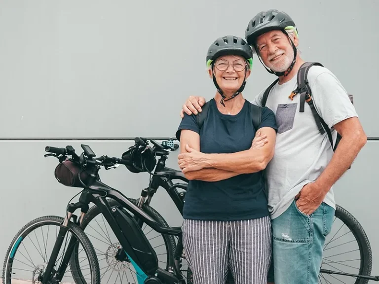 senior couple enjoying their electric bicycles