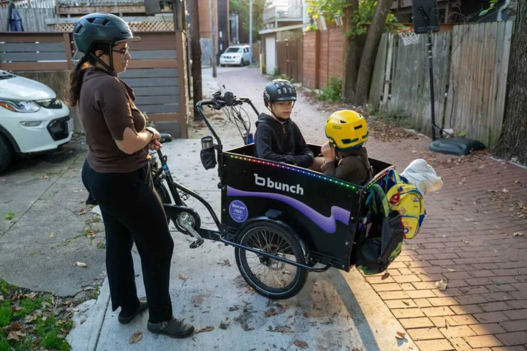 Mom with her kids in a cargo bike