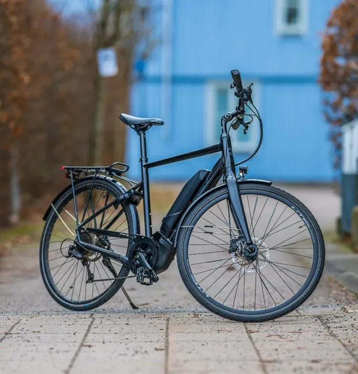 A commuter e-bike on a sidewalk