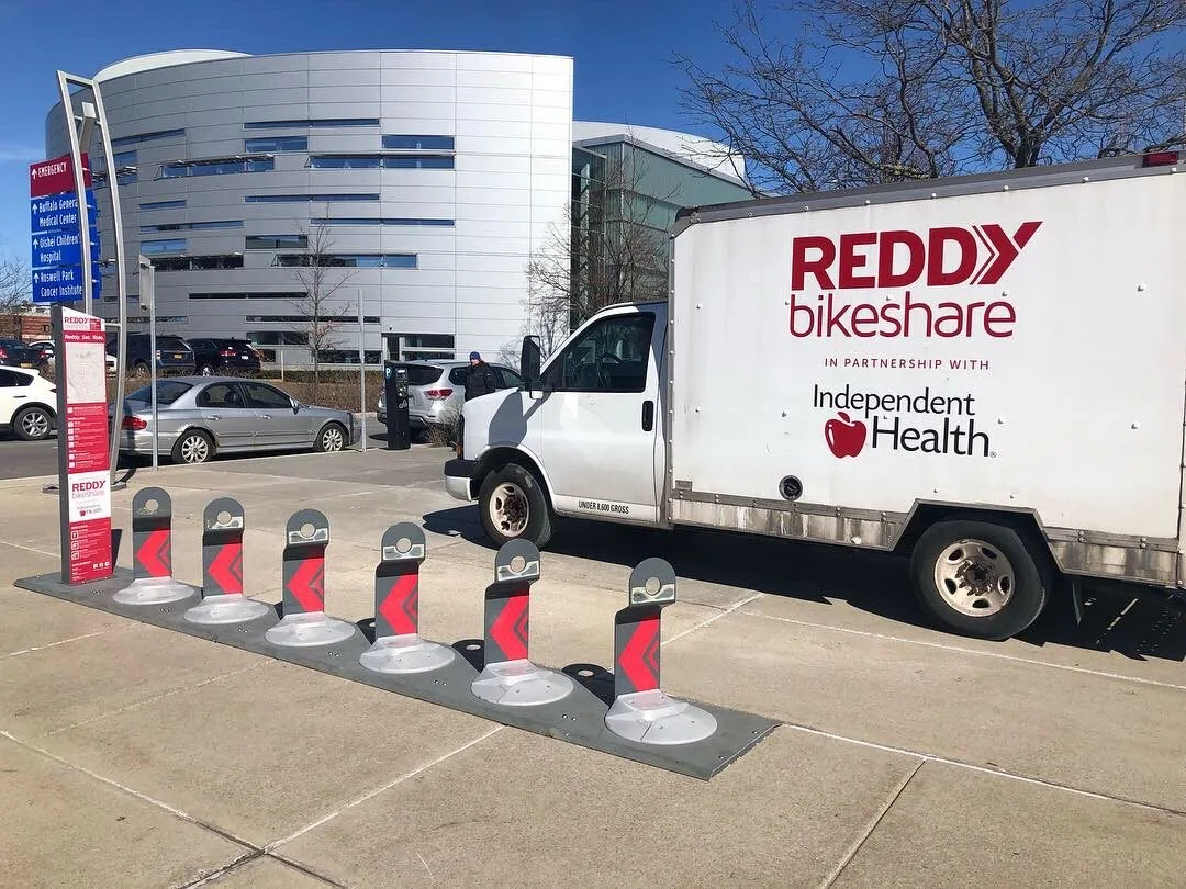A new Reddy station beside a Reddy Bikeshare and Independent Health box truck