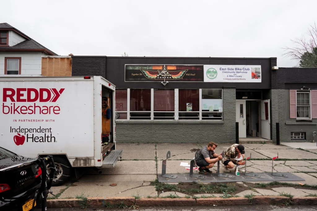 Reddy Bikeshare's Operations Team installing Reddy Bike racks outside of ESBC's Community Workshop